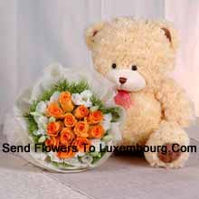 Bunch Of 11 Orange Roses And A Medium Sized Cute Teddy Bear Delivered in Luxembourg