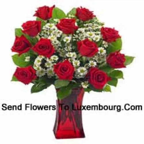 11 Red Roses With Some Ferns In A Glass Vase