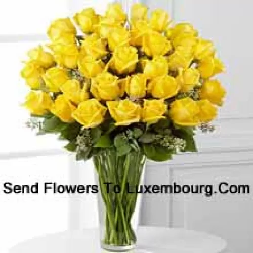 37 Yellow Roses With Some Ferns In A Glass Vase