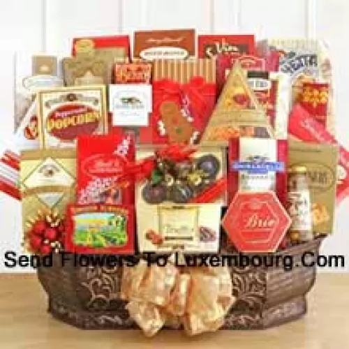 When you absolutely must make a memorable impression, our holiday extravaganza gift basket is just the thing. It's one of the largest designs we've ever created, and it's packed with so many different gourmet goodies it's almost impossible to list them all. There's plenty inside to sample, share, and share some more. We pack it all inside a gorgeous metal container that they can reuse once they manage to complete all that eating. Your lucky recipient will find Jacquot truffles, Harry & David's Moose Munch, Berry bon bons, Sonoma biscotti, chocolate chip cookies, Bellagio hot cocoa, holiday cookies, Ghirardelli chocolate squares, Cashew Roca, bruschetta toast, Brie cheese, olives, merlot cheddar cheese, smoked salmon, sesame crackers, classic water crackers, and a box of Le Grand truffles. (Please Note That We Reserve The Right To Substitute Any Product With A Suitable Product Of Equal Value In Case Of Non-Availability Of A Certain Product)